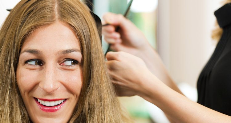 At the hairdresser - woman gets new hair colour