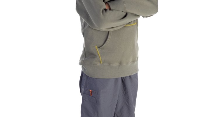 Boy wearing shorts and hooded sweatshirt