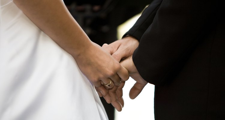 Bride and groom holding hands