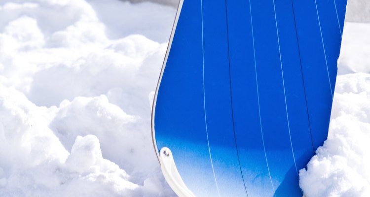 Snowboard in snow