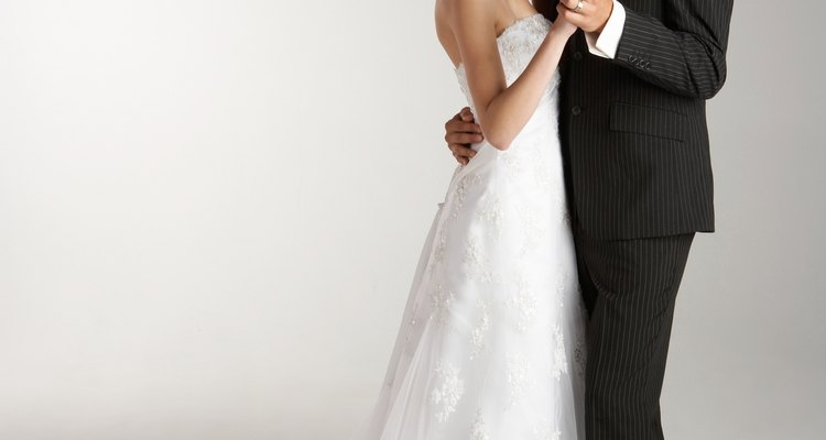 Studio shot of wedding bride and groom dancing
