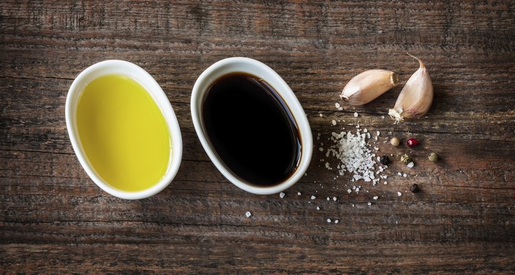 Vinaigrette dressing ingredients on vintage wood