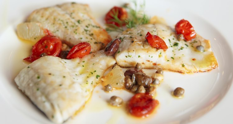 Fried fish fillet with capers and tomatoes