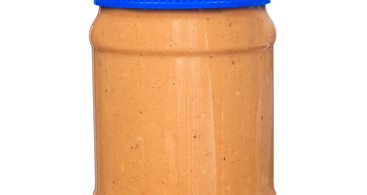 Jar of peanut butter on white