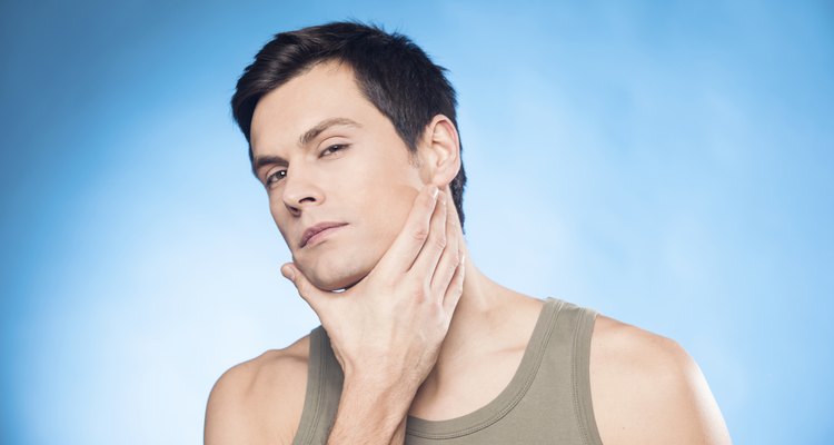 Handsome man touching his face