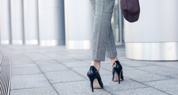 Elegant young businesswoman is going to work