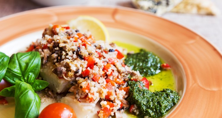 Baked halibut with vegetable garnish and couscous