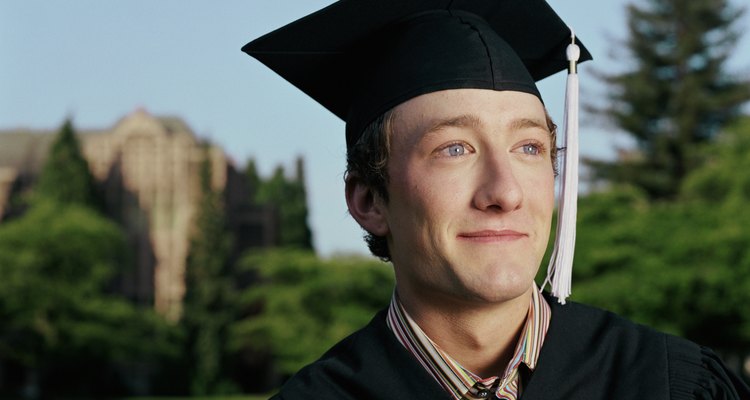 Graduate wearing cap and gown, portrait