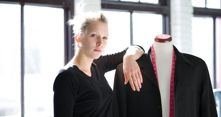 Seamstress posing by mannequins