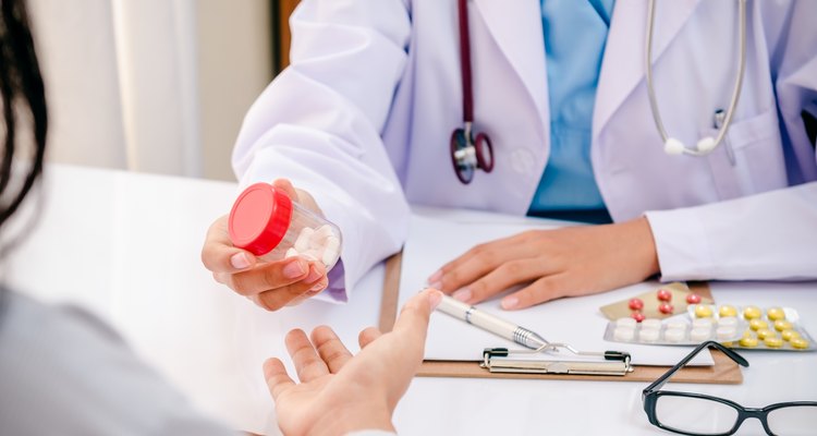 doctor giving medicine to patient