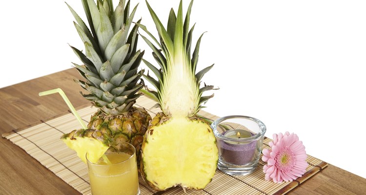 Glass of pineapple juice and fruit