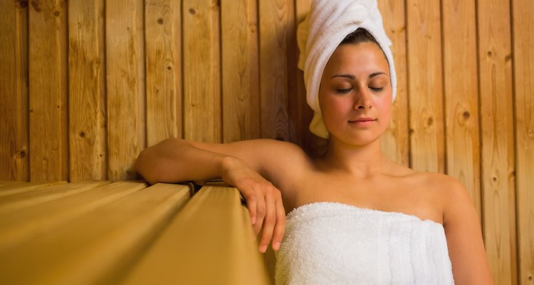 Calm woman relaxing in a sauna