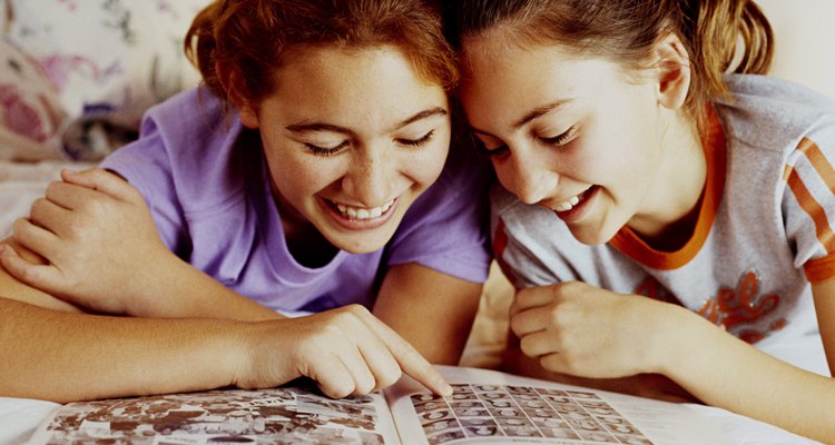 Girls looking at yearbook
