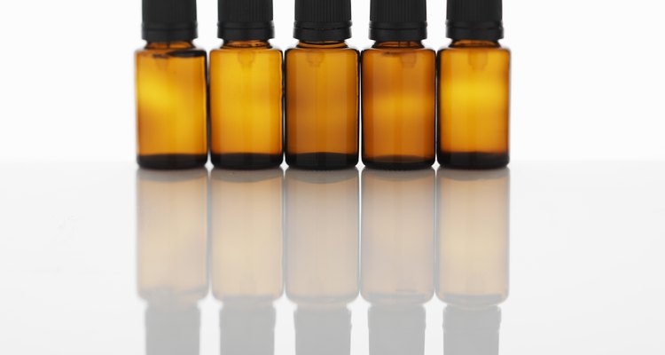 Five bottles of aromatherapy oil side by side