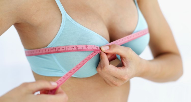 close-up of a woman measuring her bust