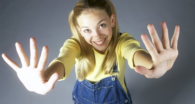 High angle view of a teenage girl with her arms stretched out