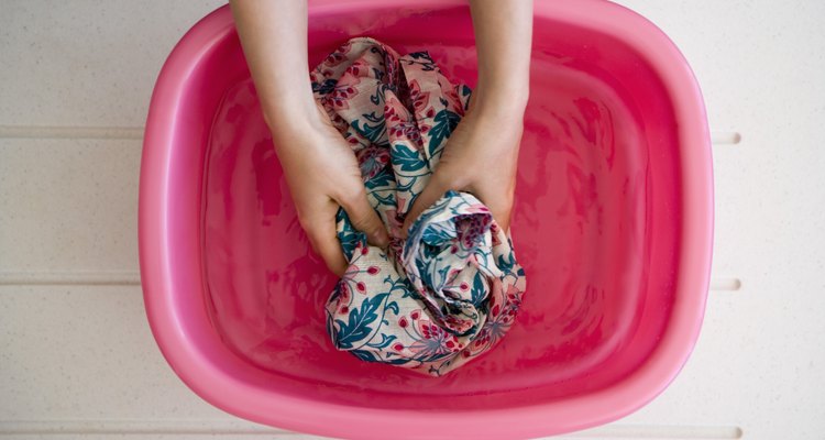 Hands washing laundry