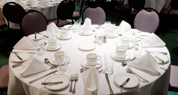 Tables with place settings in banquet room