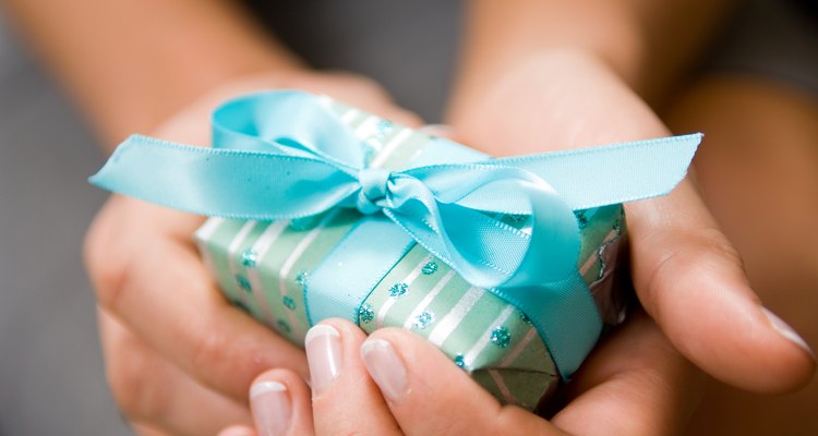 Hands holding Christmas present
