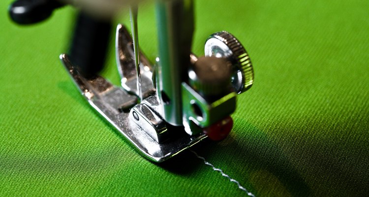 Sewing machine on green fabric