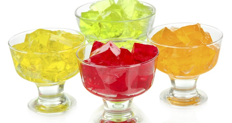 Tasty jelly cubes in bowls isolated on white