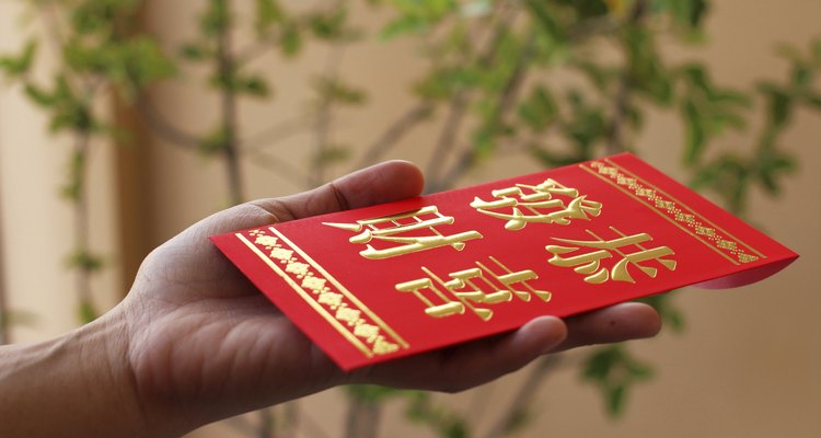Chinese red pocket on hand.
