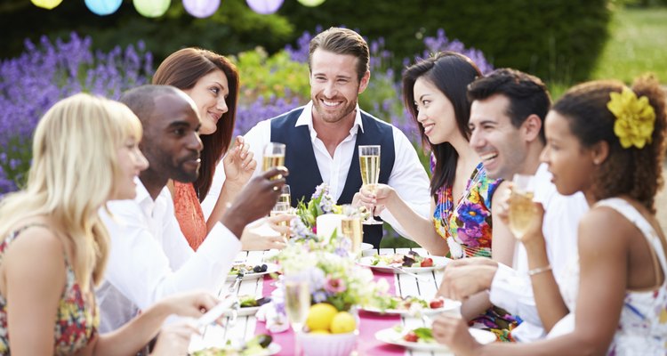 Group Of Friends Enjoying Outdoor Dinner Party
