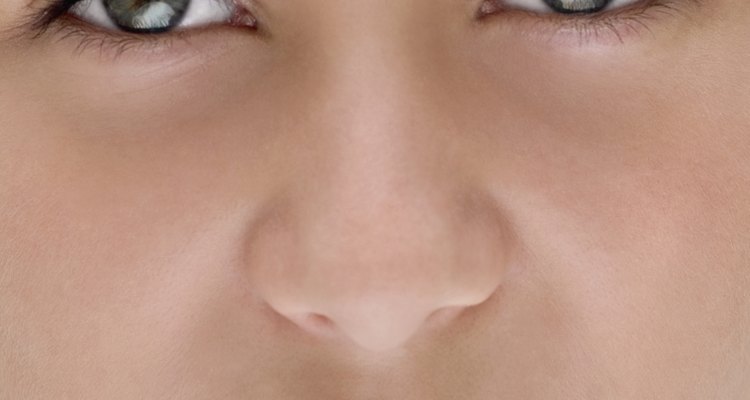 Close-up of young girl's face, part of