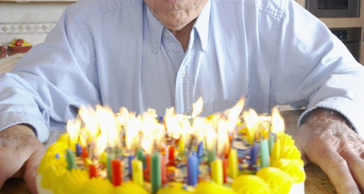 Man blowing out birthday candles