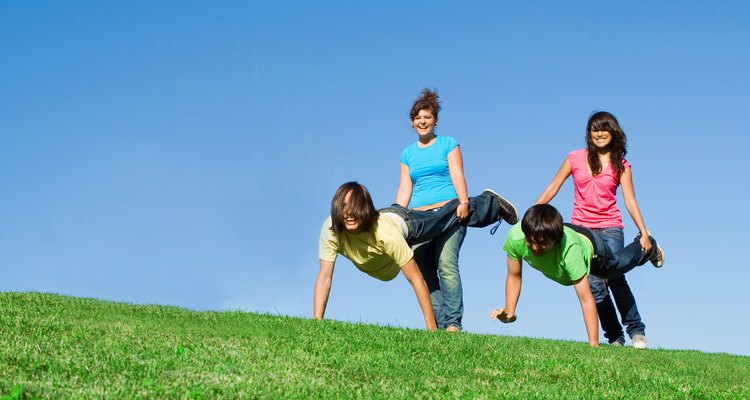 diverse group of active teens playing outdoors