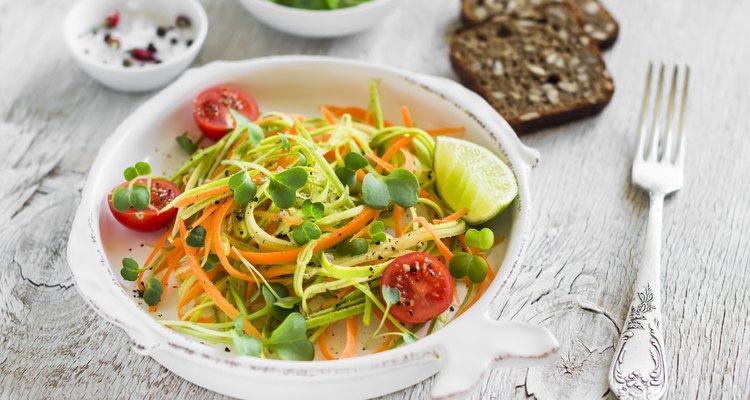 fresh salad with zucchini and carrots in a vintage plate