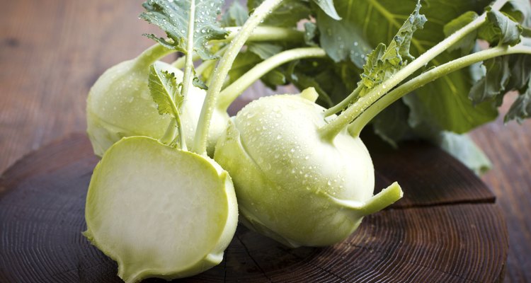 Fresh kohlrabi on the wooden table closeup