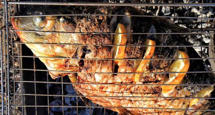 two river fish fried in grill outdoors