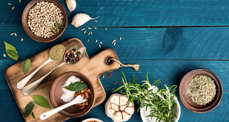 culinary background with spices on wooden table