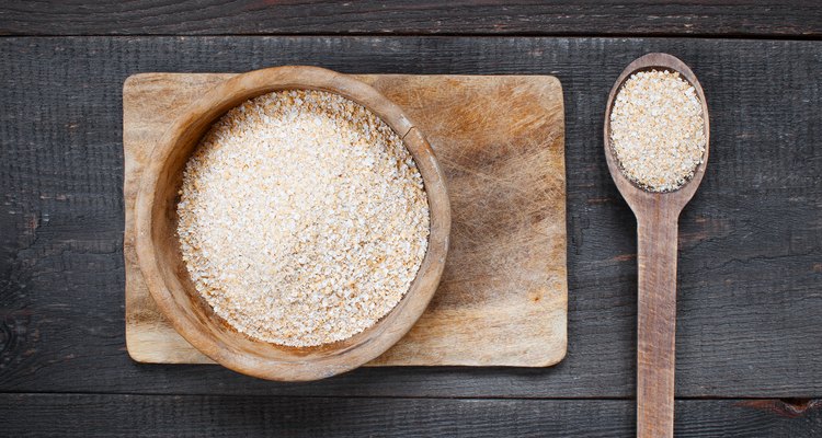 Oat bran in the wooden bowl