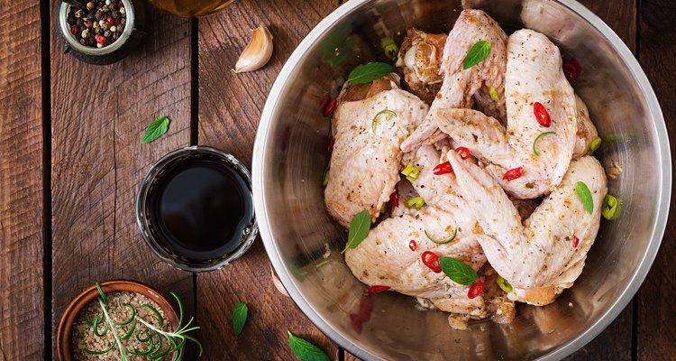 Raw marinated chicken wings prepared in Asian style